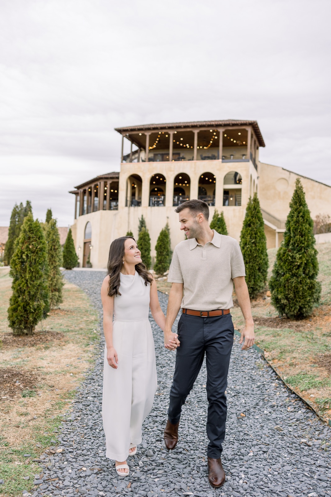 Engaged couple walking together at a North Georgia vineyard