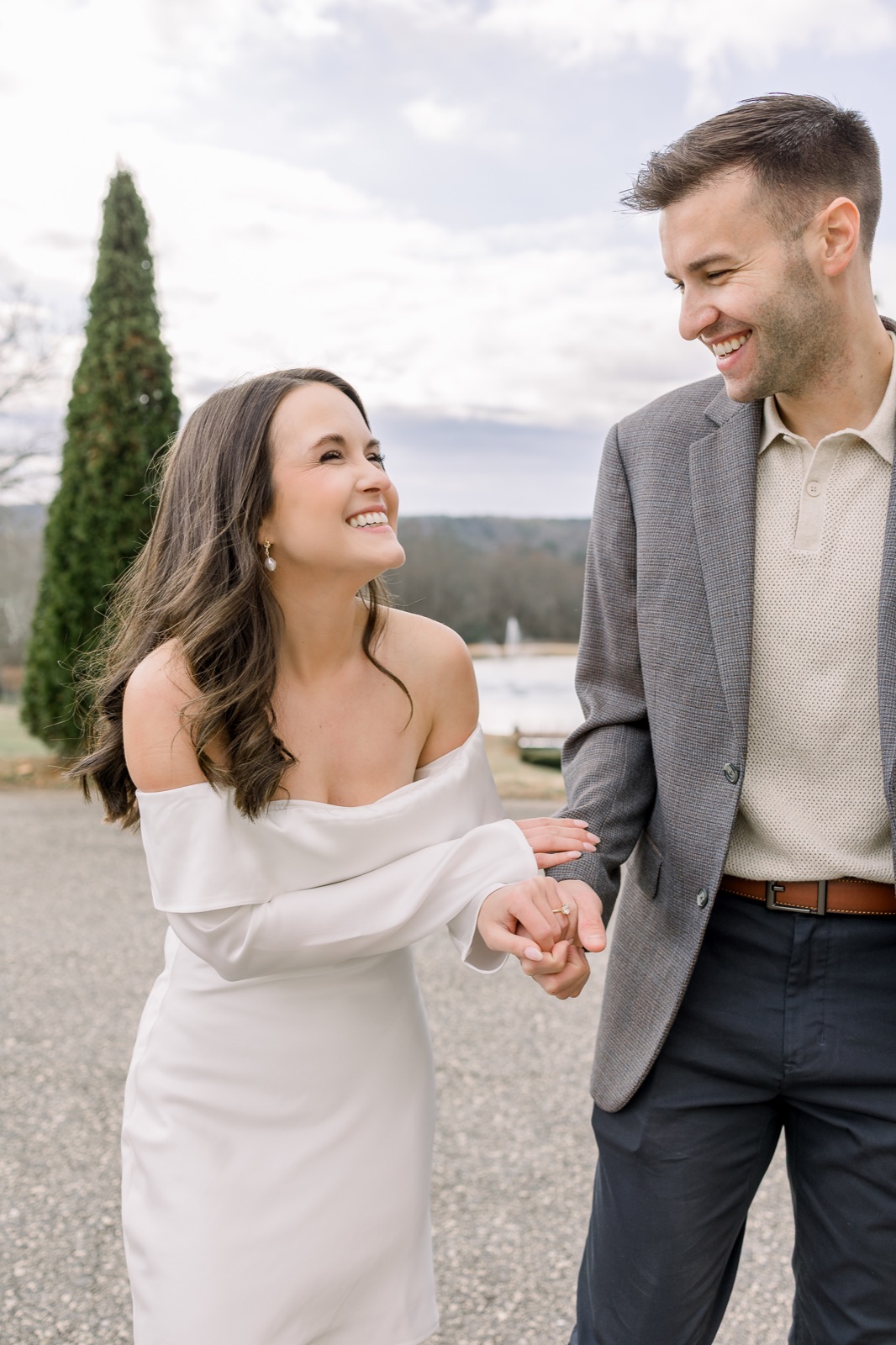 Engaged couple laughing during their engagement session