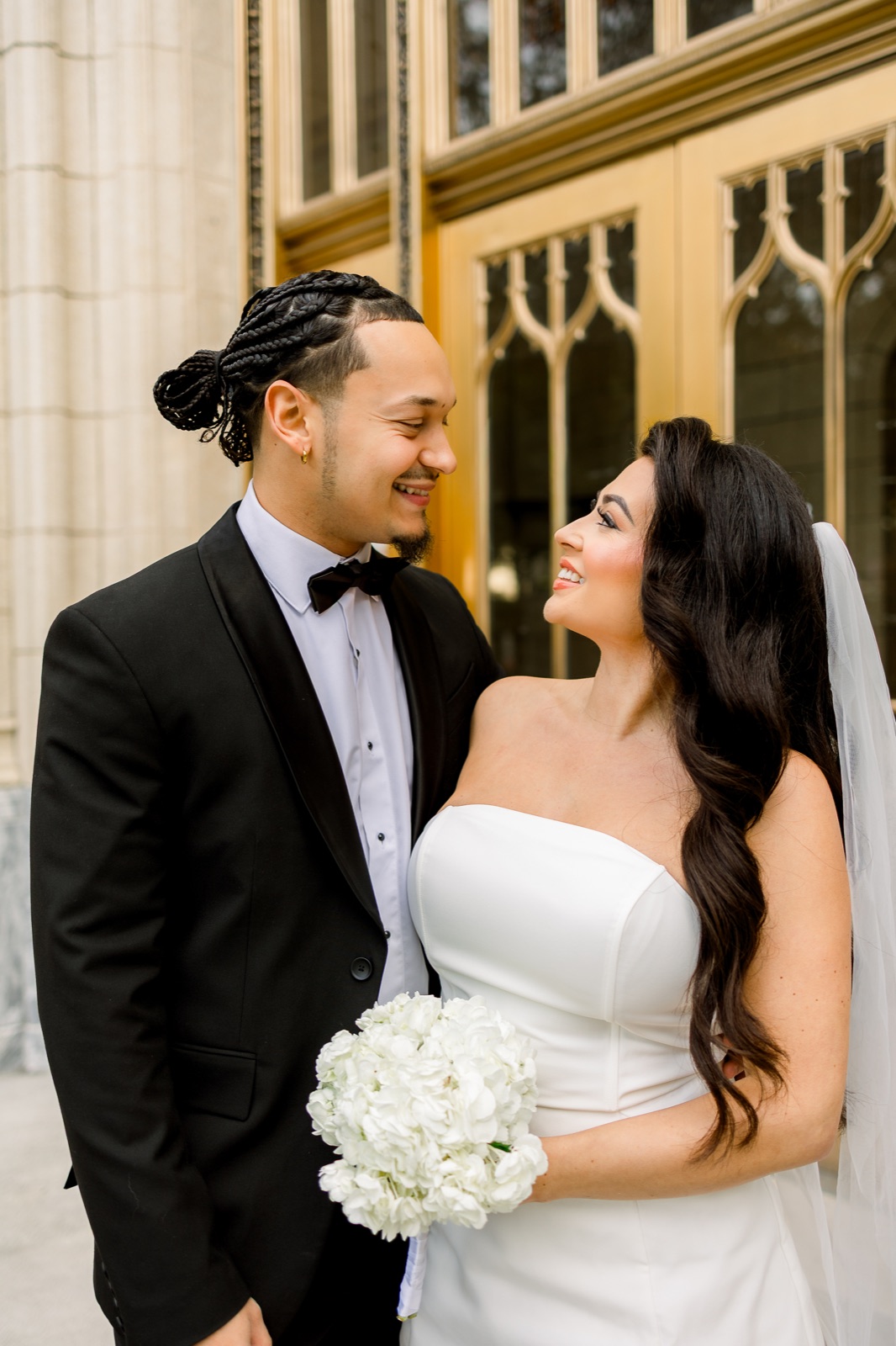 Couple smiling together outside city hall