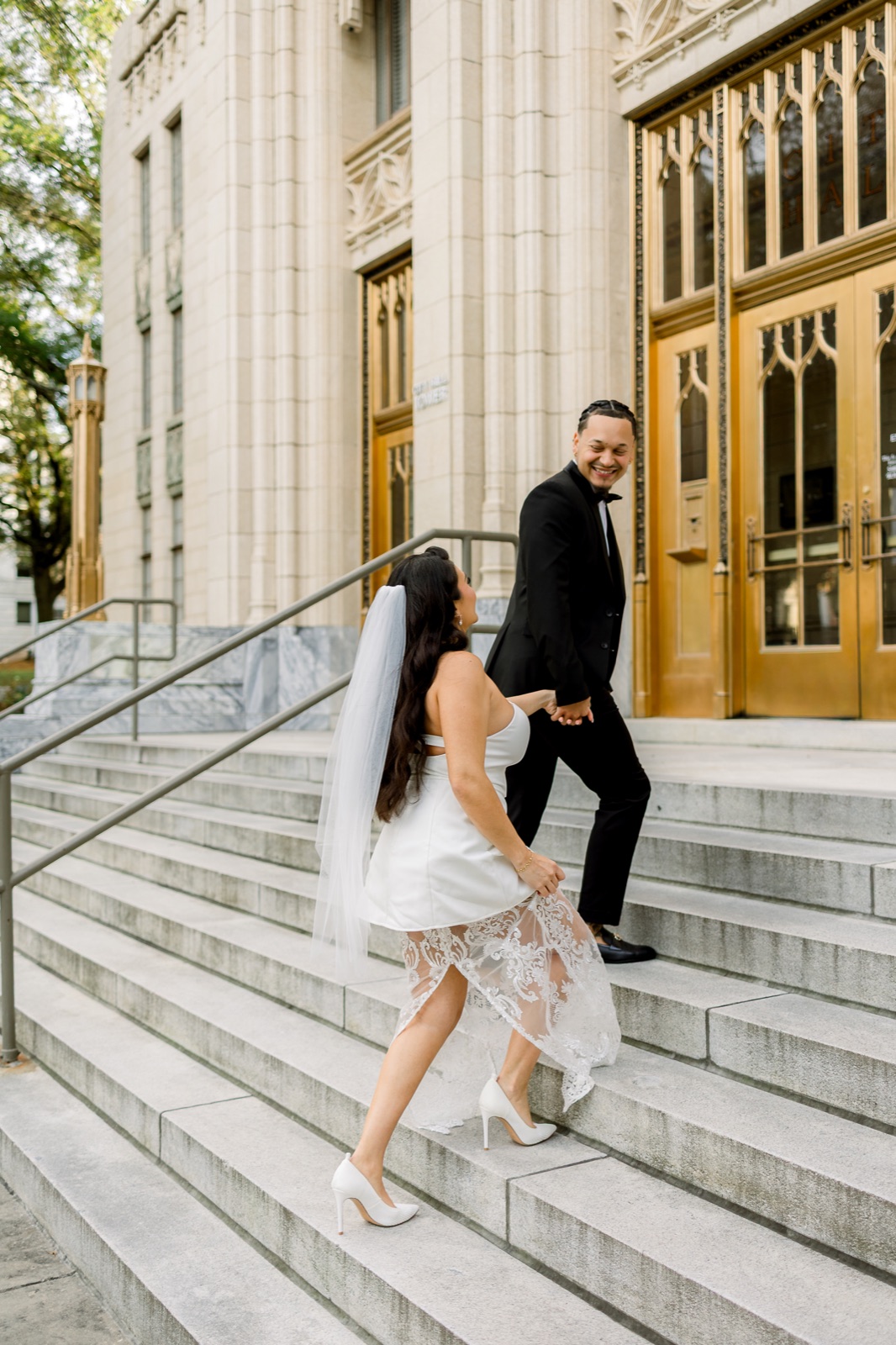 Couple walking together up the city hall steps
