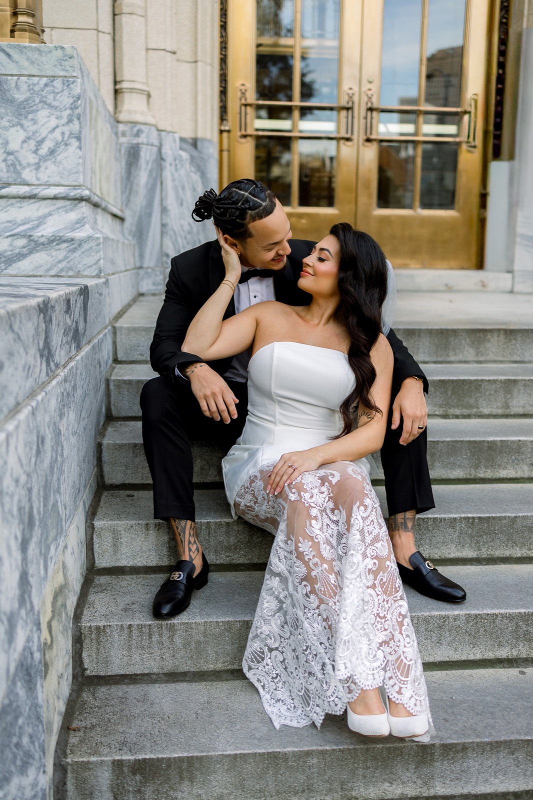 Couple seated together in an elegant city portrait