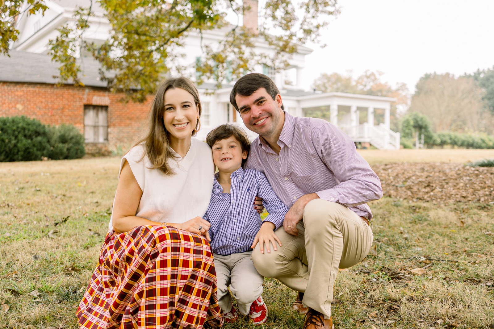 Family smiling together during an autumn session