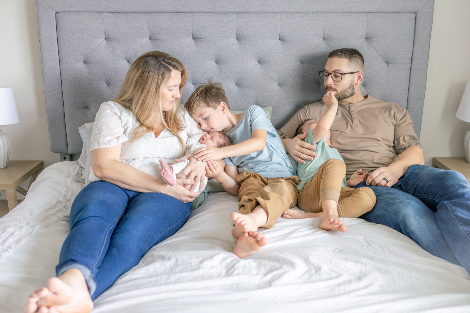 Newborn at home with his parents and older brothers