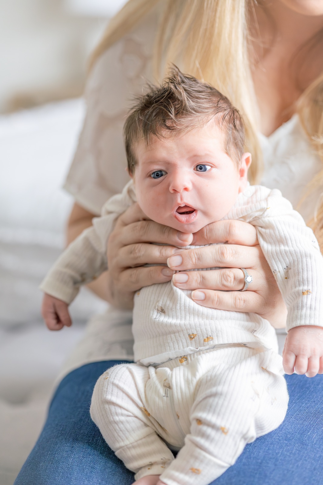 Newborn awake in his mother's arms
